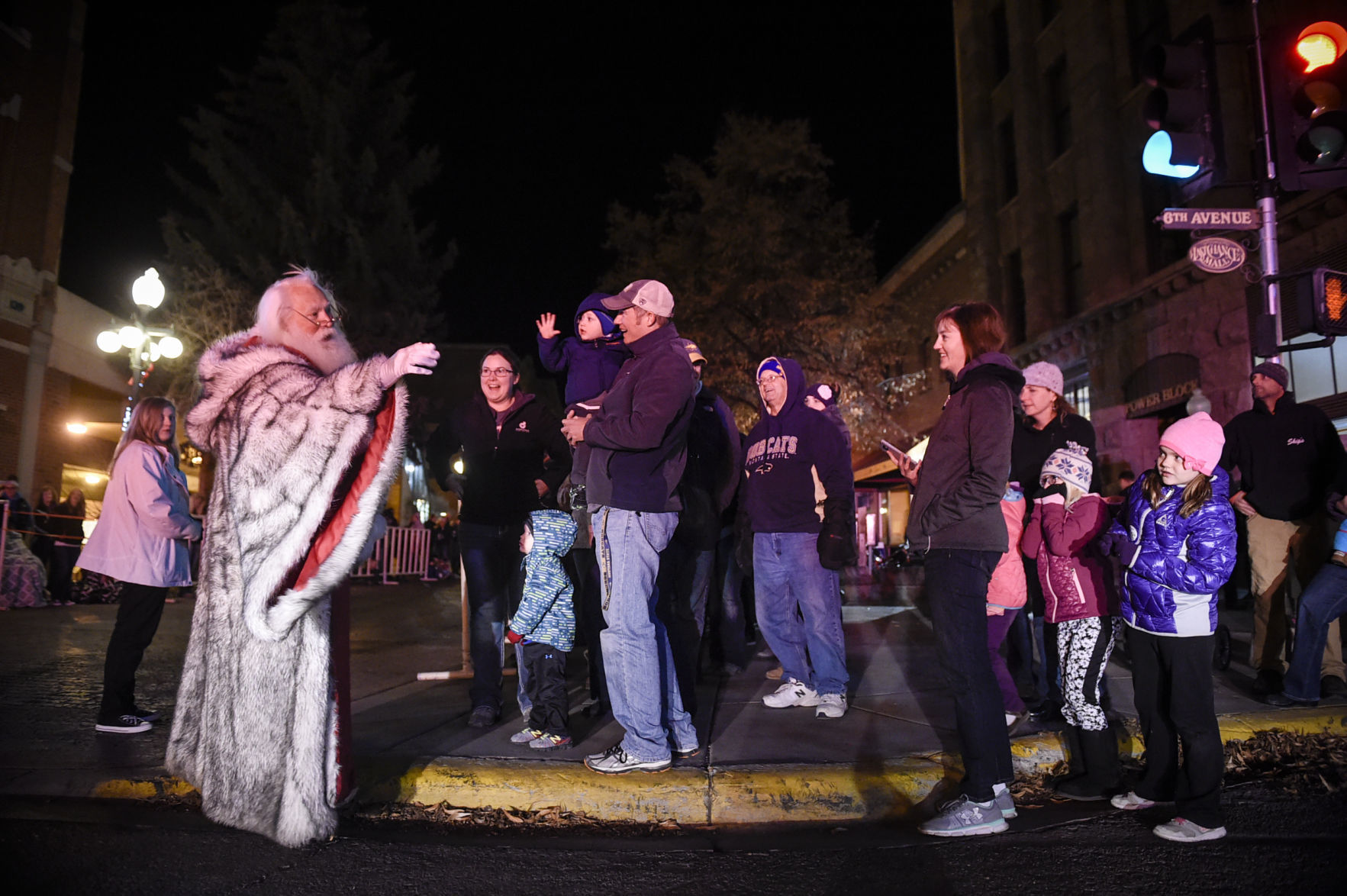 Santa Claus waves to parade watchers